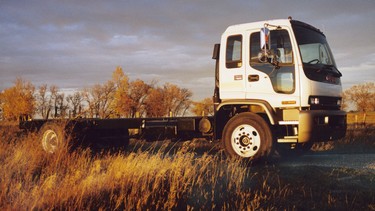 One of Garrys memorable pure driving jobs was getting a T-7500 GMC tilt chassis-cab from Calgary to Toronto. He loved the thirty-five hundred kilometres of driving that gave him a look at a world from three metres above the pavement. Drivers that high off the road are usually pulling, pushing or carrying something that is heavy, big or dangerous.