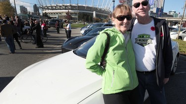 Ron and Kathleen Gonsalves pose at the end of the E-mazing Race after the couple travelled some 24,000 kilometres in their all-electric Tesla Model S.