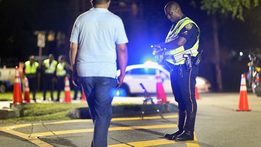 City of North Miami Beach police officer Duhamel Jeanite conducts a field sobriety test during a  DUI checkpoint on May 23, 2013 in Miami, Florida.