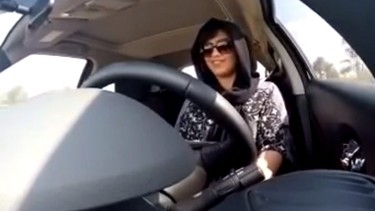This Nov. 30, 2014 image made from video released by Loujain al-Hathloul, shows her driving towards the United Arab Emirates - Saudi Arabia border before her arrest on Dec. 1, 2014, in Saudi Arabia. Two Saudi women have been detained for six days for defying the kingdom’s driving ban on females, family members and an activists said Sunday, Dec. 7, 2014. 25-year-old Al-Hathloul had been planning to defy the kingdom’s ban on women driving by crossing into her country from neighboring UAE, where she has a driver’s license.