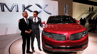 Kumar Galhotra, President of Lincoln, left, and Mark Fields, President and CEO, Ford Motor Company, pose with the Lincoln MKX during media previews for the North American International Auto Show in Detroit, Tuesday, Jan. 13, 2015.