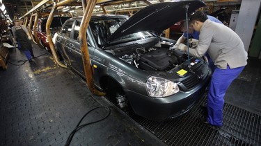 In this photo 2009 file photo, workers assemble a Lada Priora car on a production line at the Russian car maker AvtoVAZ in the Volga River town of Togliatti, Russia.