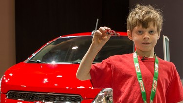 Eight-year-old Thomas at the Canadian International Auto Show.