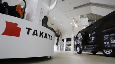 Child seats, manufactured by Takata are displayed at a Toyota showroom in Tokyo on Thursday, Nov. 6, 2014. Takata is facing three lawsuits in Canada over its defective airbags.