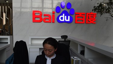 A receptionist works in the still-under-construction Baidu research and development center in Beijing.