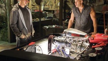 Paul Walker, left, and Vin Diesel, are shown in a scene from Fast & Furious 7.