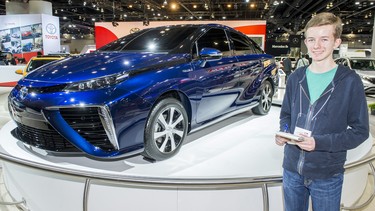 Budding automotive journalists Calvin Bergen on the convention centre with the hydrogen-powered Toyota Mirai during the press tour.