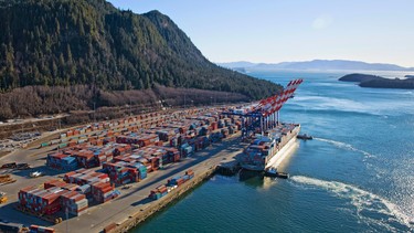 Tugs ease a container vessel into a berth at Prince Rupert’s booming Fairview Container Terminal.