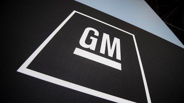 This April 8, 2009 file photo shows the General Motors logo is displayed at the New York International Auto Show in New York. The Canadian government is selling its remaining block of shares in GM, worth about $2.7 billion.