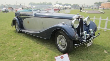 This is a very rare 1936 Lanchester with a Vanden Plas coachbuild body. The engine is a 4 Ω litre straight eight. The car was originally delivered to the Maharaja of Nawanagar. It is now owned by Mr. Hormusji Cama and placed second in its class at the 2000 Pebble Beach Concours in California but is seen here at the 2015 Cartier Travel with Style Concours in Delhi, India.