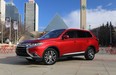 The 2016 Mitsubishi Outlander, parked with Edmonton city hall in the background, was unveiled at the Edmonton Motorshow.