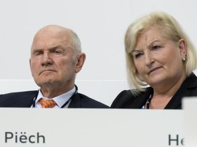 In this May 22, 2014 file photo Chairman of the board of Volkswagen AG Ferdinand Piech and his wife Ursula Piech, member of the board, attend a meeting of Audi in Ingolstadt, Germany. Piech and his wife will step back from their posts as Volkswagen announced on Saturday, April 25, 2015.