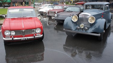 Rally cars parked in the rain for the start of the Hagerty Spring Thaw Classic Car Adventure in Hope, B.C.
