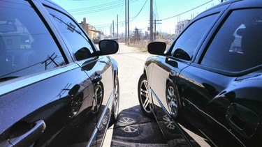 A 2009 Chrysler 300 on the left and 2006 Dodge Charger R/T on the right with tinted windows.