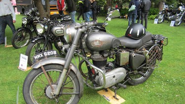 Shad Lievesley's award-winning 1959 Royal Enfield Bullet with the Graham Hill-design crash helmet sitting on the seat.