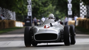 Sir Stirling Moss drives the Mercedes W196 during the Goodwood Festival of Speed at Goodwood House on June 28, 2014 in Chichester, England.