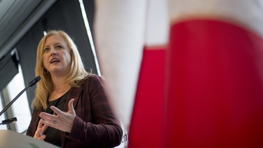 In this file photo, Transport Minister Lisa Raitt speaks to the Toronto Board of Trade in Toronto, Ontario, Friday, October 17, 2014. Raitt wants to introduce legislation that will force automakers to recall vehicles in Canada.