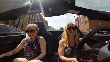 Kids go for a spin in the McLaren 650S Spider supercar.