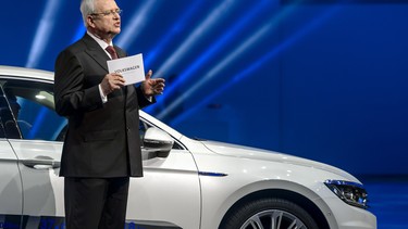 Volkswagen Group CEO Martin Winterkorn delivers his speech as he stands next to the European Car of the Year for 2015, the VW Passat, during Volkswagen Group Night ahead of the 2015 Geneva Motor Show.