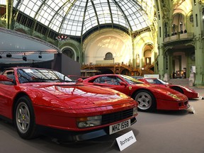 A Ferrari Testarossa and a Ferrari F40 are seen during a vintage cars and motorbikes exhibition, by Bonhams auction house, at Le Grand Palais on February 5, 2015 in Paris, France.  Vintage Ferraris are skyrocketing in value, a trend that Ferrari's upcoming stock offering could be tough to match.