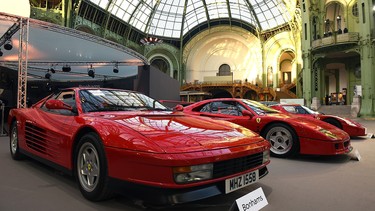 A Ferrari Testarossa and a Ferrari F40 are seen during a vintage cars and motorbikes exhibition, by Bonhams auction house, at Le Grand Palais on February 5, 2015 in Paris, France.  Vintage Ferraris are skyrocketing in value, a trend that Ferrari's upcoming stock offering could be tough to match.