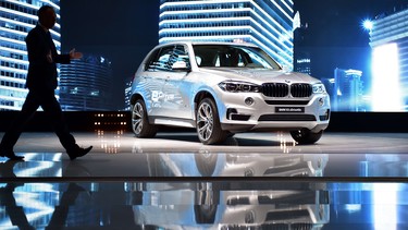 A BMW X5 xDrive 40e is displayed during a presentation at Auto Shanghai 2015 on April 20, 2015. Auto sales in China decreased 3.2 per cent through June, with BMW leading the declines.