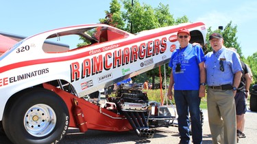 Former Chrysler engineers and Ramchagers members Bob Lees (right) and Troy Simonsen with a Ramchargers funny car. Simonsen is making an appearance at the 2015 Northern Mopars Show and Shine in Calgary on Saturday, Aug. 15.