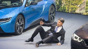 BMW CEO Harald Krueger falls to the ground during a presentation at the 2015 Frankfurt Motor Show. Hundreds of thousands of visitors are expected to crowd into the massive exhibition halls of Frankfurt's sprawling trade fair grounds later this week  to catch a glimpse of the latest models and high tech innovations.