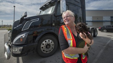 Marijke Brouwer, with her dog Buddy, used to go on long hauls, but now drives the Vancouver/Seattle/Portland corridor.