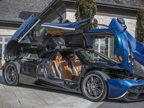 The Pagani Huayra sits open to the sky, like a carbon fibre orchid.
