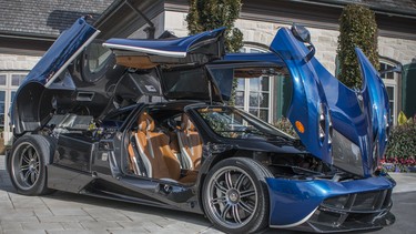 The Pagani Huayra sits open to the sky, like a carbon fibre orchid.