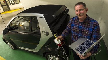 Stuart Evans charged his computer with electricity from his smart car during last weekend’s power failure.