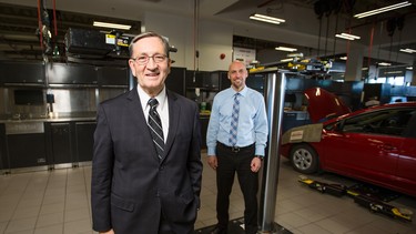 Brian Heninger, left, and Dave Verboom stand in the brand new 70,000 square feet Heninger Toyota service centre in Calgary.