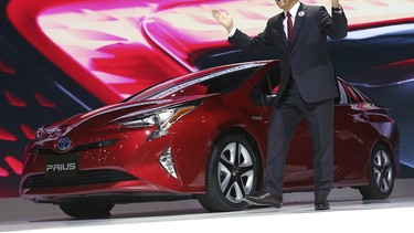 Akio Toyoda presents the latest Prius hybrid at this year's Tokyo Motor Show.
