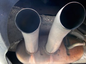 The exhaust of a Volkswagen Passat Bluemotion is photographed in Frankfurt, Germany, Thursday, Sept. 24, 2015.