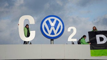 Greenpeace activists demonstrate at the entrance to the Volkswagen plant in Wolfsburg, central Germany, on November 9, 2015.