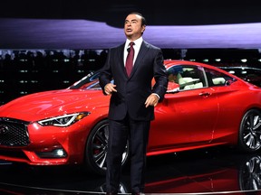 Nissan CEO Carlos Ghosn speaks after unveiling their Infiniti Q60 during the press preview of the 2016 North American International Auto Show in Detroit, Michigan, on January 11, 2016.