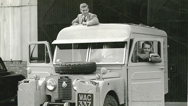 Robert Bateman and Bristol Foster picking up their new special order 1957 Land Rover in England before embarking on their world tour.