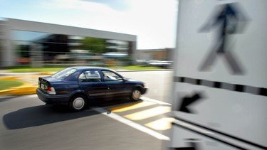 A car zooms past a cross walk on Jules-Poitras street in Montreal Wednesday June 19, 2002, at a designated crosswalk without slowing down. If you see (or cause) an accident – especially if a pedestrian is involved – it's your duty to help.
