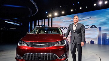 FCA head of passenger car brands Tim Kuniskis presents the Chrysler 2017 Pacifica minivan during the press preview of the 2016 North American International Auto Show in Detroit, Michigan, on January 11, 2016.