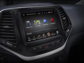 This product image provided by Fiat Chrysler Automobiles shows the Uconnect 8.4 inch infotainment system on a 2014 Jeep Cherokee Limited. Harman International, the company that makes car radios that friendly hackers exploited to take control of a Jeep Cherokee on Tuesday, Aug. 4, 2015, said its other infotainment systems don't have the same security flaw.