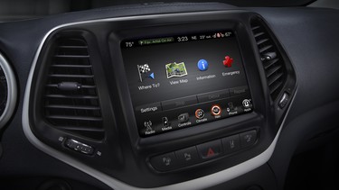 This product image provided by Fiat Chrysler Automobiles shows the Uconnect 8.4 inch infotainment system on a 2014 Jeep Cherokee Limited. Harman International, the company that makes car radios that friendly hackers exploited to take control of a Jeep Cherokee on Tuesday, Aug. 4, 2015, said its other infotainment systems don't have the same security flaw.