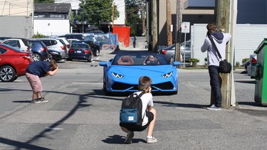 Left to right: Cooper Rychkun, Landon Brown and Blake Jennings train their talented eyes on a Lamborghini Huracan in Supercar Alley.