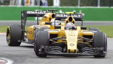 Renault driver Jolyon Palmer (30), from Great Britain, leads teammate Kevin Magnussen, from Denmark, through the Senna corner at the Canadian Grand Prix, Sunday, June 12, 2016 in Montreal.