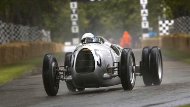 Pink Floyd drummer Nick Mason behind the wheel of the 1936 Auto Union Type C at Goodwood Festival of Speed.