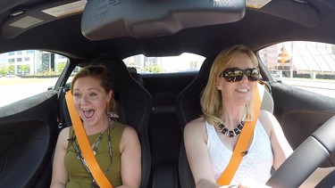 Passenger Sarah Gannage and Lorraine Sommerfeld laugh it up in the McLaren 570S.