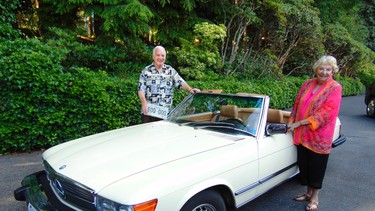 Former B.C. Solicitor General and Attorney General Russ Fraser holds the first collector vehicle license plate. Jone Fraser has owned her Mercedes Benz 450SL since buying it new in 1980.