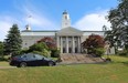 The 2016 Chevrolet Malibu in front of Acadia University Hall in Wolfville, N.S.