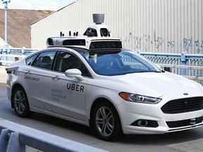 A self-driving Ford Fusion for Uber is test driven in Pittsburgh.