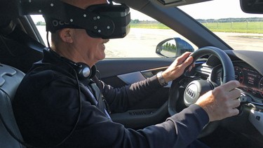 Graeme Fletcher dons a virtual reality headset as he tries out Audi's virtual driver training simulator.